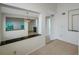 Open living room, with tiled floors, that flows into other living spaces for entertaining at 5014 Sterling Manor Dr, Tampa, FL 33647