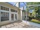 Relax on this screened patio with tiled flooring and views of the backyard at 5014 Sterling Manor Dr, Tampa, FL 33647