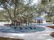 Community playground featuring modern play equipment and a gazebo in a park-like setting at 5014 Sterling Manor Dr, Tampa, FL 33647