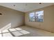 Sunlit bedroom with large windows and smooth concrete floor, ready for new finishes at 5026 Water Oak Dr # 220, Bradenton, FL 34207