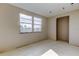 Bright bedroom ready for new finishes featuring new paint and large windows at 5026 Water Oak Dr # 220, Bradenton, FL 34207