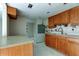 An unfinished kitchen awaiting customization, featuring wooden cabinets and countertops at 5026 Water Oak Dr # 220, Bradenton, FL 34207