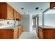 Kitchen features wooden cabinets, countertops and a sink; ready to be remodeled at 5026 Water Oak Dr # 220, Bradenton, FL 34207
