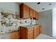 Kitchen features wooden cabinets, countertops and a sink; ready to be remodeled at 5026 Water Oak Dr # 220, Bradenton, FL 34207