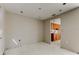 Open-concept living room with view into the kitchen; ready to be remodeled at 5026 Water Oak Dr # 220, Bradenton, FL 34207