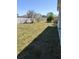 Spacious back yard with trees and grass at 5166 Deltona Blvd, Spring Hill, FL 34606
