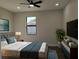 Comfortable bedroom with large window, modern decor, and a cozy atmosphere at 5166 Deltona Blvd, Spring Hill, FL 34606