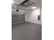Garage with epoxy flooring and metal door at 5166 Deltona Blvd, Spring Hill, FL 34606
