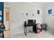 This bedroom includes light tile floors, Sonic-themed decor, and a black computer desk at 5208 S 82Nd St, Tampa, FL 33619