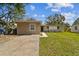 Single-story home with a well-kept lawn, convenient driveway, and quaint front facade at 5208 S 82Nd St, Tampa, FL 33619