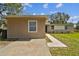 Charming single-story home with a concrete walkway and a quaint, neutral-toned exterior at 5208 S 82Nd St, Tampa, FL 33619