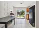 An open kitchen with tile flooring features sliding glass doors leading to the backyard at 5208 S 82Nd St, Tampa, FL 33619