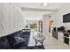 Open floor plan showing living room and kitchen with access to backyard at 5208 S 82Nd St, Tampa, FL 33619