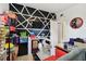 Functional spare room with graphic black and white accent wall and door to adjoining space at 5208 S 82Nd St, Tampa, FL 33619