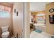 This well-lit bathroom features a soaking tub under a large window and a toilet at 5444 90Th Avenue E Cir, Parrish, FL 34219