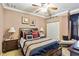 Bedroom features a ceiling fan, crown molding, and coordinated decor at 5444 90Th Avenue E Cir, Parrish, FL 34219