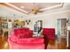 Open-concept living area with hardwood floors, recessed ceiling, and seamless kitchen access at 5444 90Th Avenue E Cir, Parrish, FL 34219