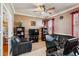 Inviting living room with leather seating, TV, bookshelves, and neutral colors at 5444 90Th Avenue E Cir, Parrish, FL 34219