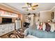 Cozy main bedroom with crown molding, a ceiling fan, a walk-in closet, and neutral decor at 5444 90Th Avenue E Cir, Parrish, FL 34219