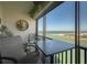 This balcony provides comfortable seating, a table and great scenic views of the ocean at 7150 Sunset Way # 903, St Pete Beach, FL 33706