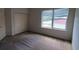 Bedroom featuring a closet and a large window that allows natural light to flood the space at 7279 Maidencane Ct, Seminole, FL 33777
