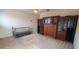 Bedroom with carpet, display case and murphy bed at 7279 Maidencane Ct, Seminole, FL 33777