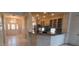 Kitchen view towards the home's entry showing tile floors and ample counter space at 7279 Maidencane Ct, Seminole, FL 33777