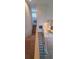 A carpeted staircase with white and black railings leading to the upper levels of the home at 7279 Maidencane Ct, Seminole, FL 33777