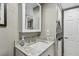 Bathroom with granite countertop vanity, large mirror, and linen closet at 7300 Sun Island S Dr # 1705, South Pasadena, FL 33707