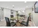Cozy dining room with a glass-topped table, seating for four, and neutral décor at 7300 Sun Island S Dr # 1705, South Pasadena, FL 33707