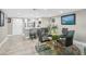 Bright dining area that flows into an open kitchen and features seating for six at 7300 Sun Island S Dr # 1705, South Pasadena, FL 33707
