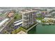 High-rise condo building boasts numerous private balconies with views of the canal, pool, and surrounding neighborhood at 7300 Sun Island S Dr # 1705, South Pasadena, FL 33707