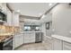 Contemporary kitchen with stainless steel appliances, quartz countertop, and open layout at 7300 Sun Island S Dr # 1705, South Pasadena, FL 33707