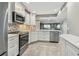 Updated kitchen with stainless steel appliances and view into the living space at 7300 Sun Island S Dr # 1705, South Pasadena, FL 33707