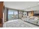 Relaxing living room features comfortable seating, water views, and a large window at 7300 Sun Island S Dr # 1705, South Pasadena, FL 33707