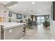 Bright, open-concept living area with tile floors, views of the ocean, and modern furnishings at 7300 Sun Island S Dr # 1705, South Pasadena, FL 33707