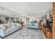 Open floor plan living space with a neutral color palette and wall mirror at 7300 Sun Island S Dr # 1705, South Pasadena, FL 33707