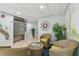Inviting lobby area with comfortable seating, greenery, and convenient elevator access at 7300 Sun Island S Dr # 1705, South Pasadena, FL 33707