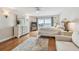 Comfortable main bedroom with balcony access offering beautiful waterfront views, wood floors, and a ceiling fan at 7300 Sun Island S Dr # 1705, South Pasadena, FL 33707