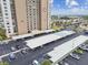 Well-maintained parking lot providing residents covered parking with manicured landscaping at 7300 Sun Island S Dr # 1705, South Pasadena, FL 33707