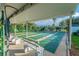 Enjoy a game of shuffleboard in this covered area surrounded by lush landscaping and seating areas at 7300 Sun Island S Dr # 1705, South Pasadena, FL 33707