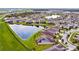 Aerial view of neighborhood with pond at 8100 Olive Brook Dr, Wesley Chapel, FL 33545
