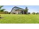 Spacious backyard featuring lush green grass and a well-maintained lawn at 8100 Olive Brook Dr, Wesley Chapel, FL 33545