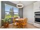 Bright breakfast nook with wood table, seating for four and natural light overlooking the lawn at 8100 Olive Brook Dr, Wesley Chapel, FL 33545