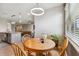 Cozy breakfast nook features a wood table, seating for four and natural light at 8100 Olive Brook Dr, Wesley Chapel, FL 33545