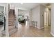 Open hallway with a carpeted staircase and hard wood floors leading into the main living space at 8100 Olive Brook Dr, Wesley Chapel, FL 33545