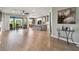 Spacious living room featuring hardwood floors, an open layout, and modern finishes at 8100 Olive Brook Dr, Wesley Chapel, FL 33545