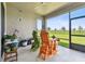 Relaxing screened patio with chairs, providing a serene view of the backyard at 8100 Olive Brook Dr, Wesley Chapel, FL 33545