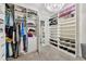 Organized walk-in closet with built-in shelves and drawers providing plenty of storage space for clothes and accessories at 8100 Olive Brook Dr, Wesley Chapel, FL 33545