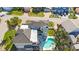 Aerial shot showcasing the pool, spiral staircase, and the meticulously landscaped backyard at 816 Ponce De Leon Dr, Tierra Verde, FL 33715